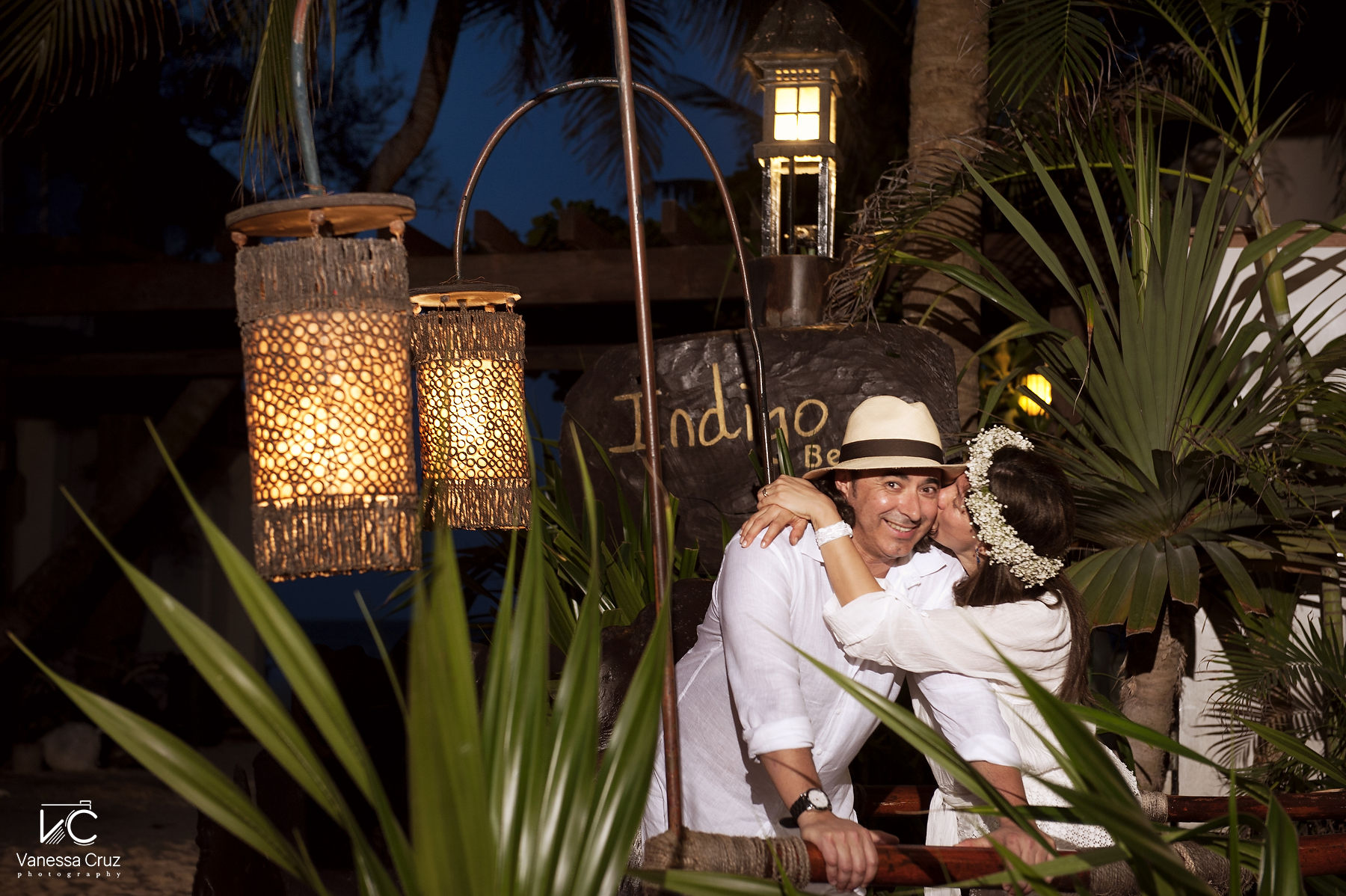 Bride kissing groom beach romantic dinner Playa del Carmen Mexico