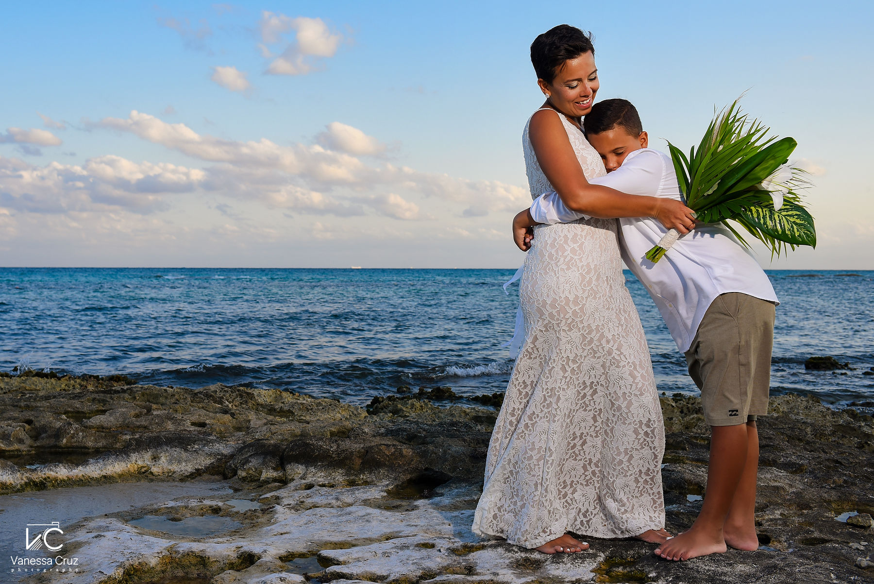 Bride and son beach portraits Wedding Vow Renewal Mayan Palace Riviera Maya Mexico