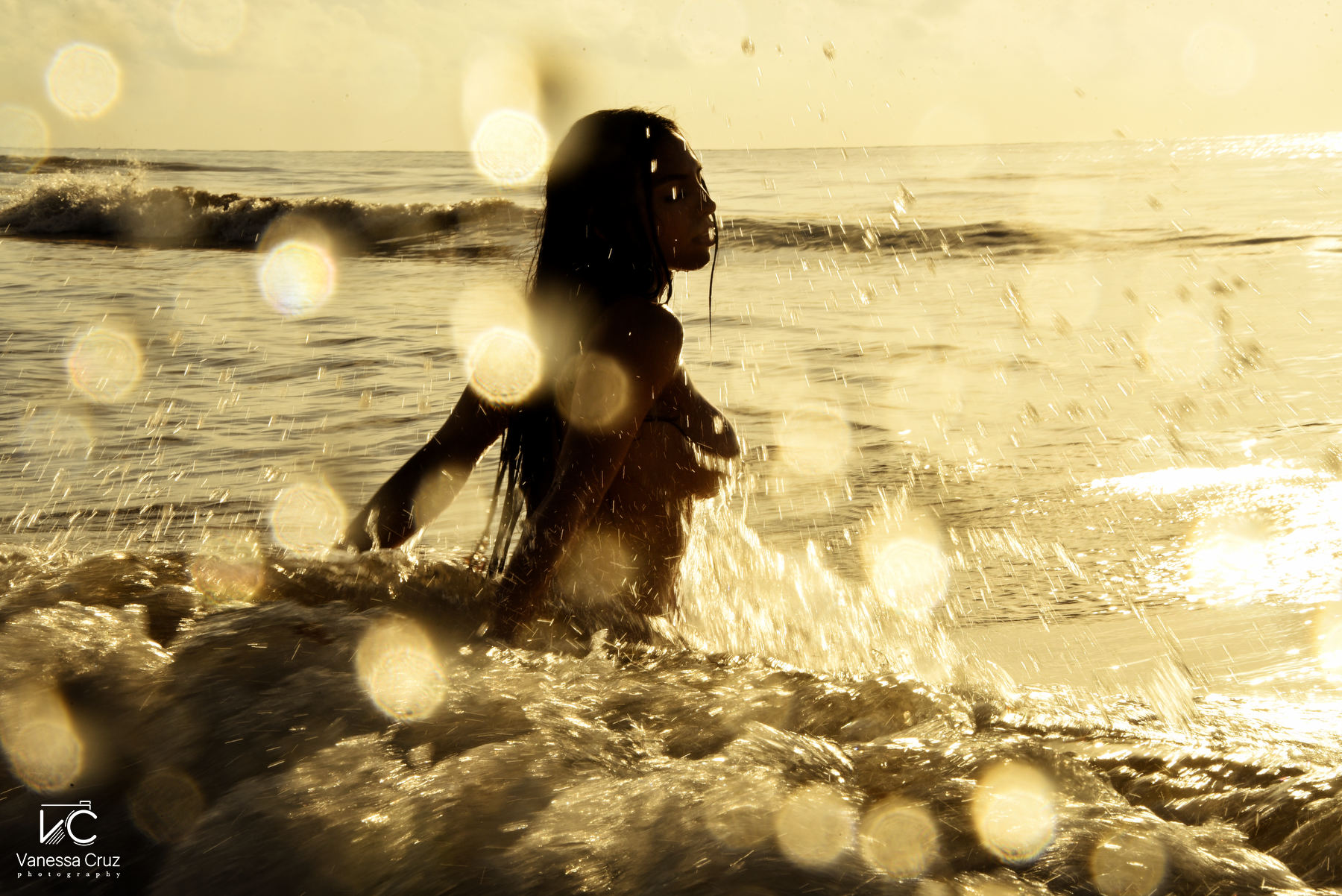 Woman playing waves boudoir photography Playa del Carmen Mexico