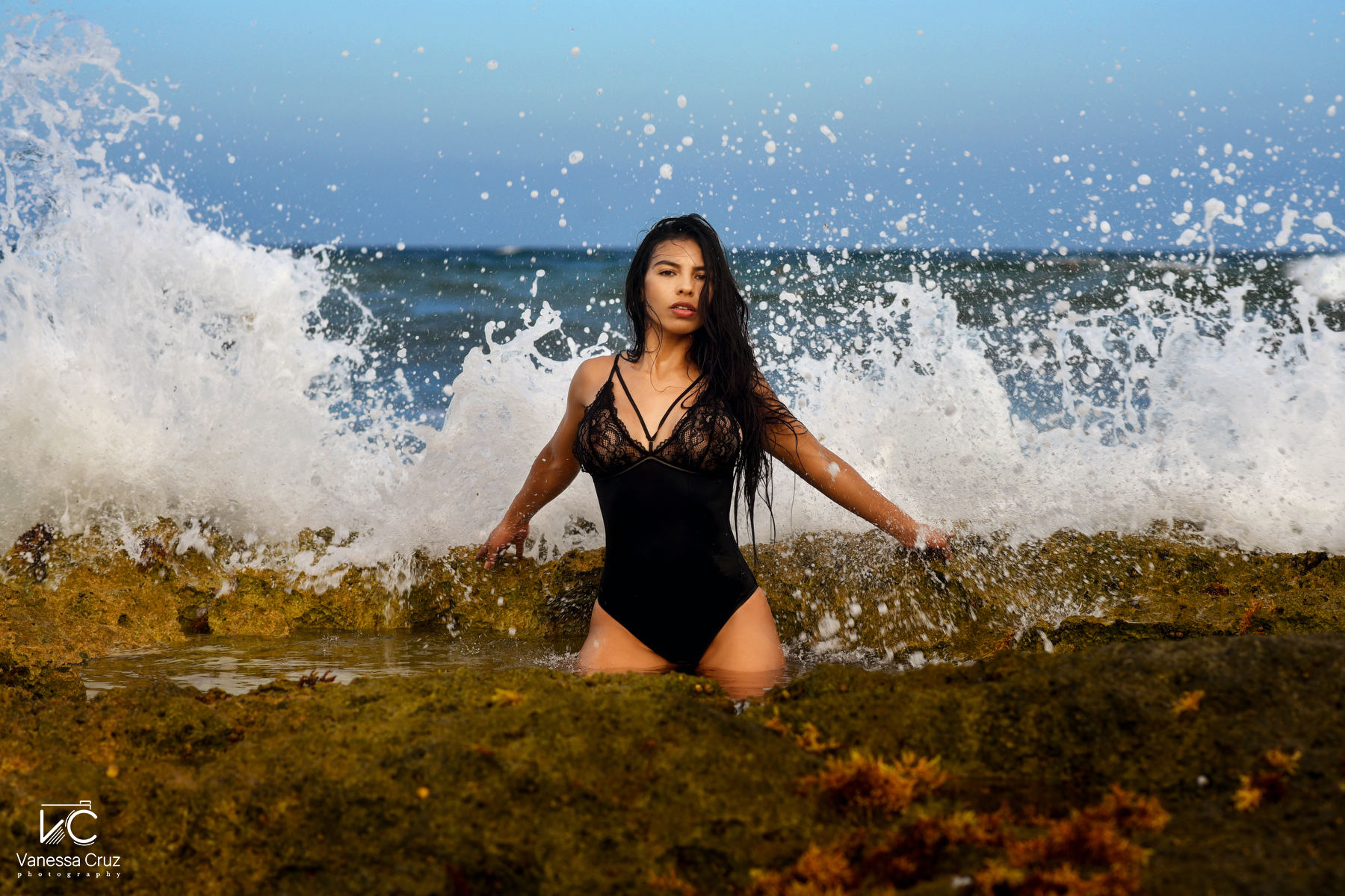 Sexy woman between waves Riviera Maya Mexico