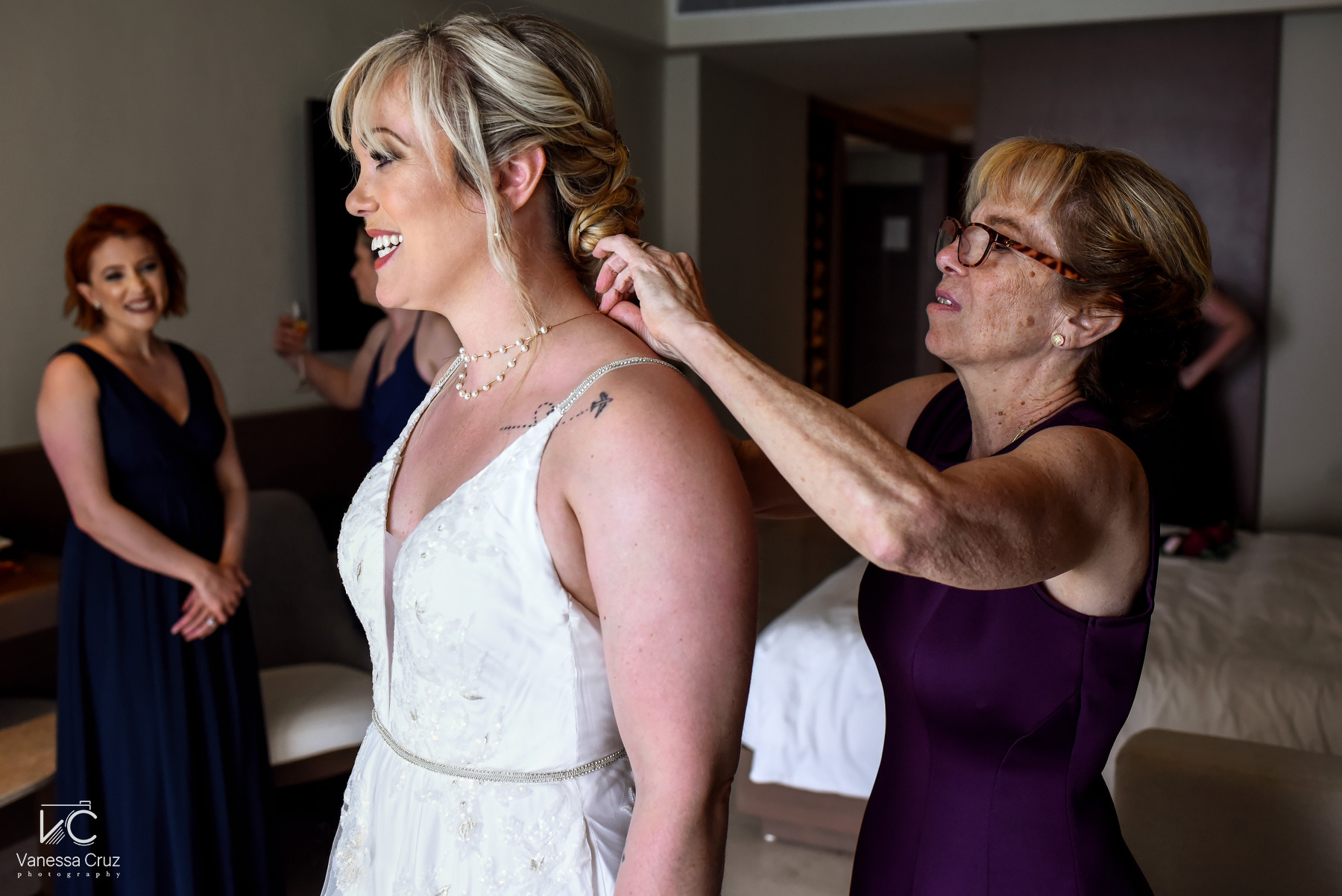 mom helping bride getting ready wedding Hyatt Ziva Cancun