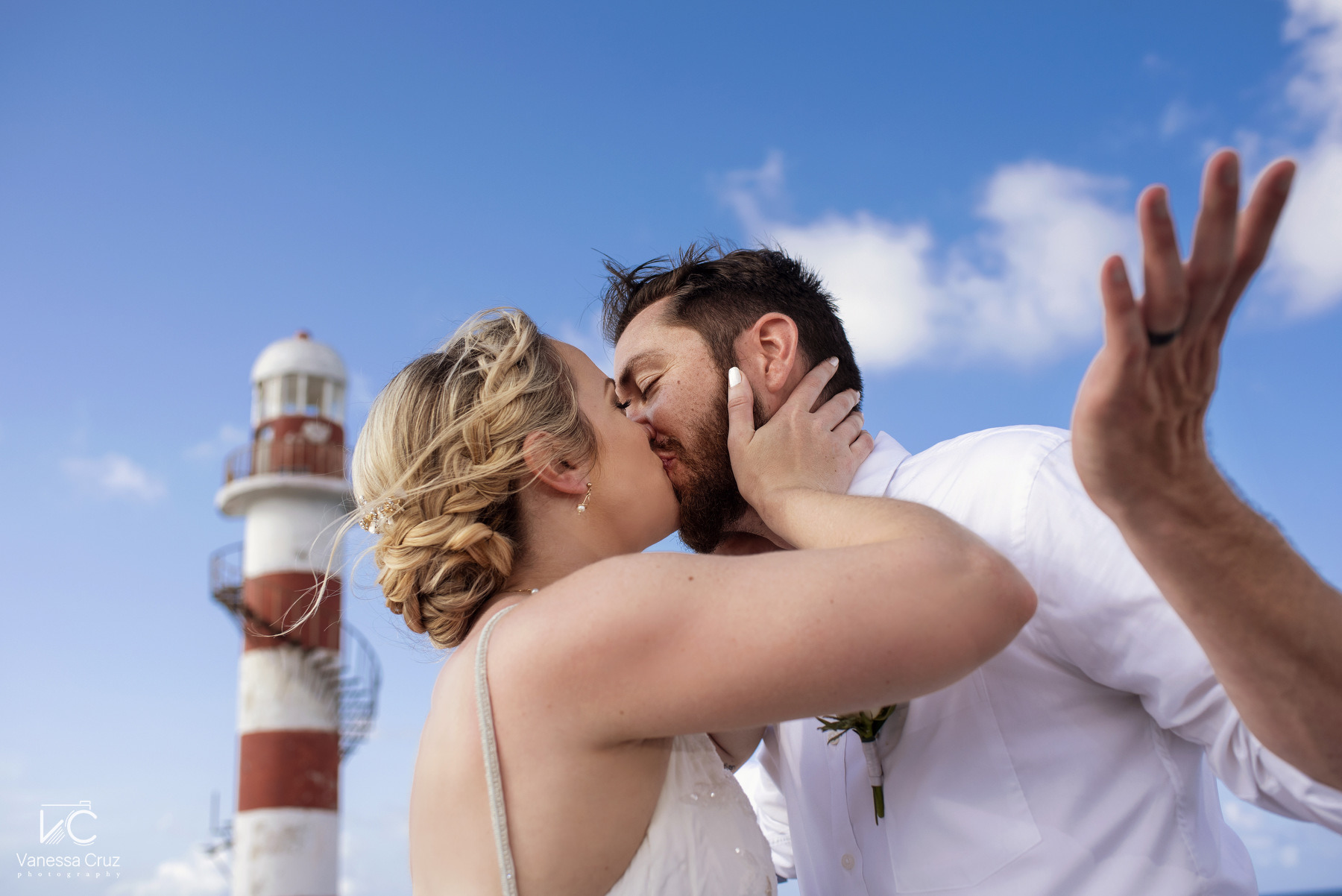 Bride and groom kissing Lighthouse Hyatt Ziva Cancun Mexico