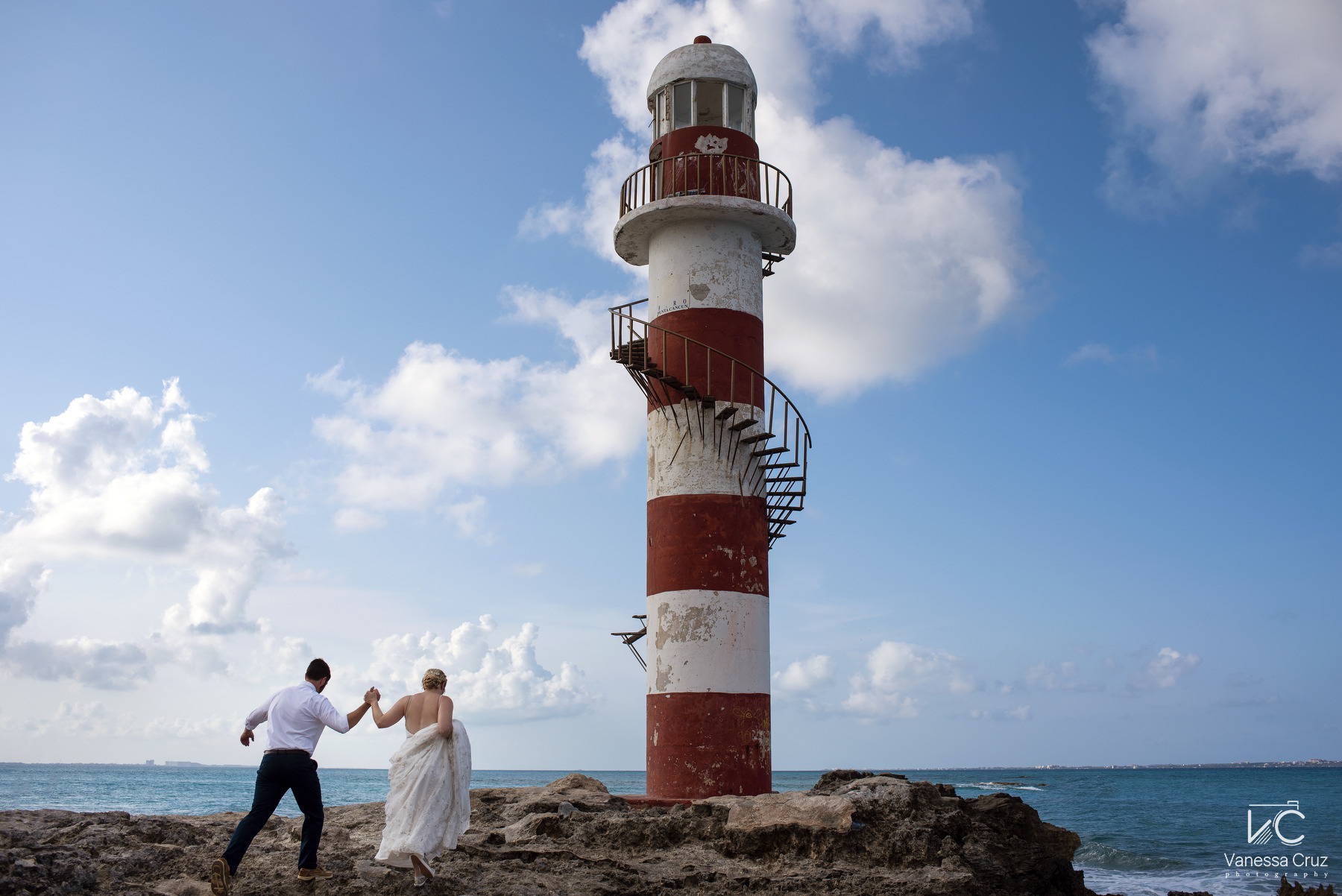 bride and groom walking Lighthouse Hyatt Ziva Cancun Mexico