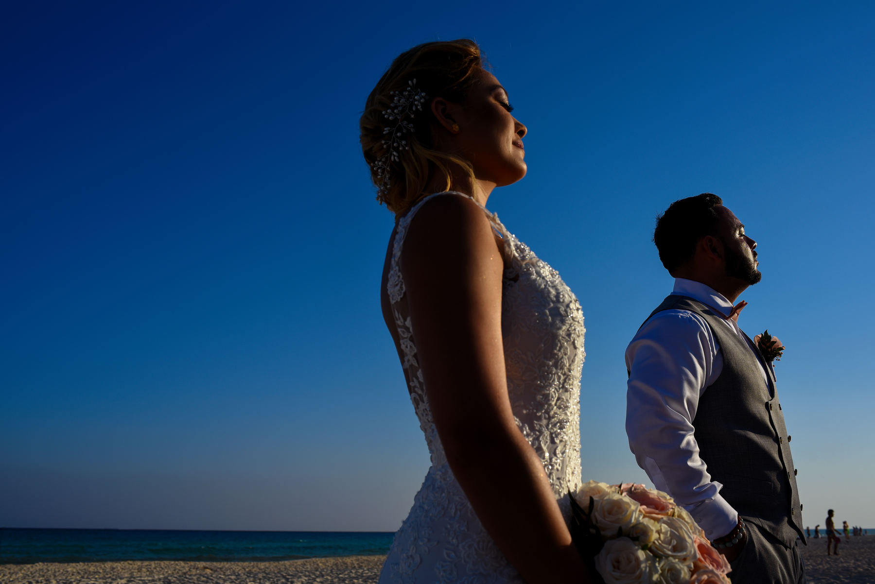 Bride and groom beach sunset creative portrait Playa del Carmen Mexico wedding